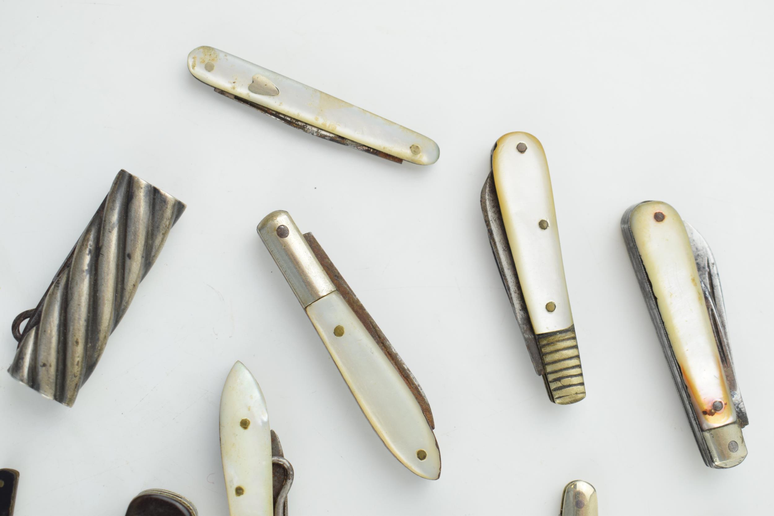 A collection of antique multifunction tool pocket knives to include mother pot pearl handled example - Image 4 of 9