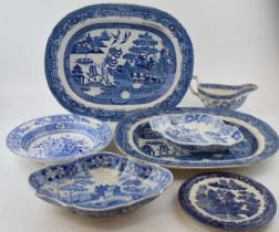 A group of early 19 th century blue and white transfer-printed wares, to include: two Willow pattern