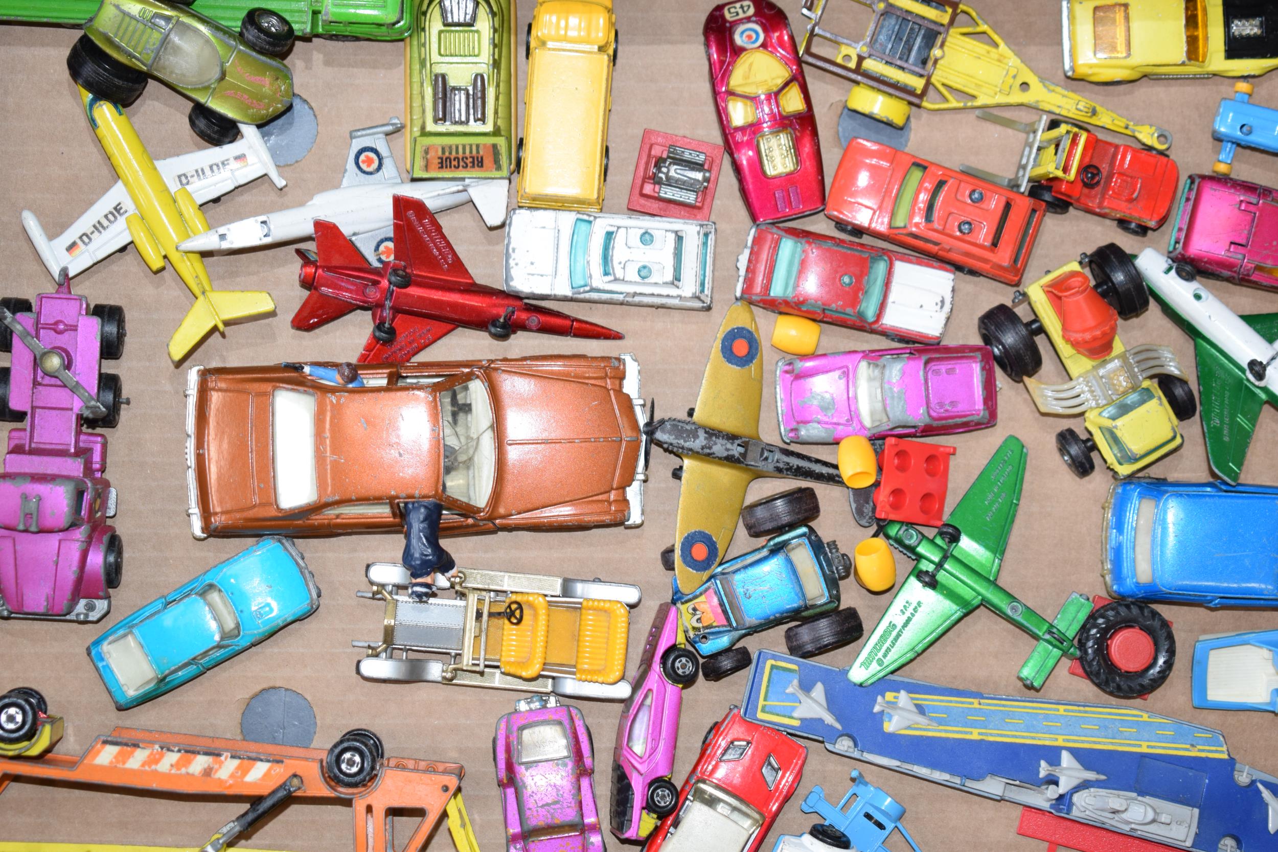 A collection od die-cast vehicles to include a Corgi Kojak vehicle, a Matchbox Ford, an Alfa Carabo,