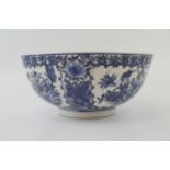 A large blue and white Chinese bowl with character marks to the base. 10” wide. In good condition.