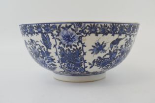 A large blue and white Chinese bowl with character marks to the base. 10” wide. In good condition.