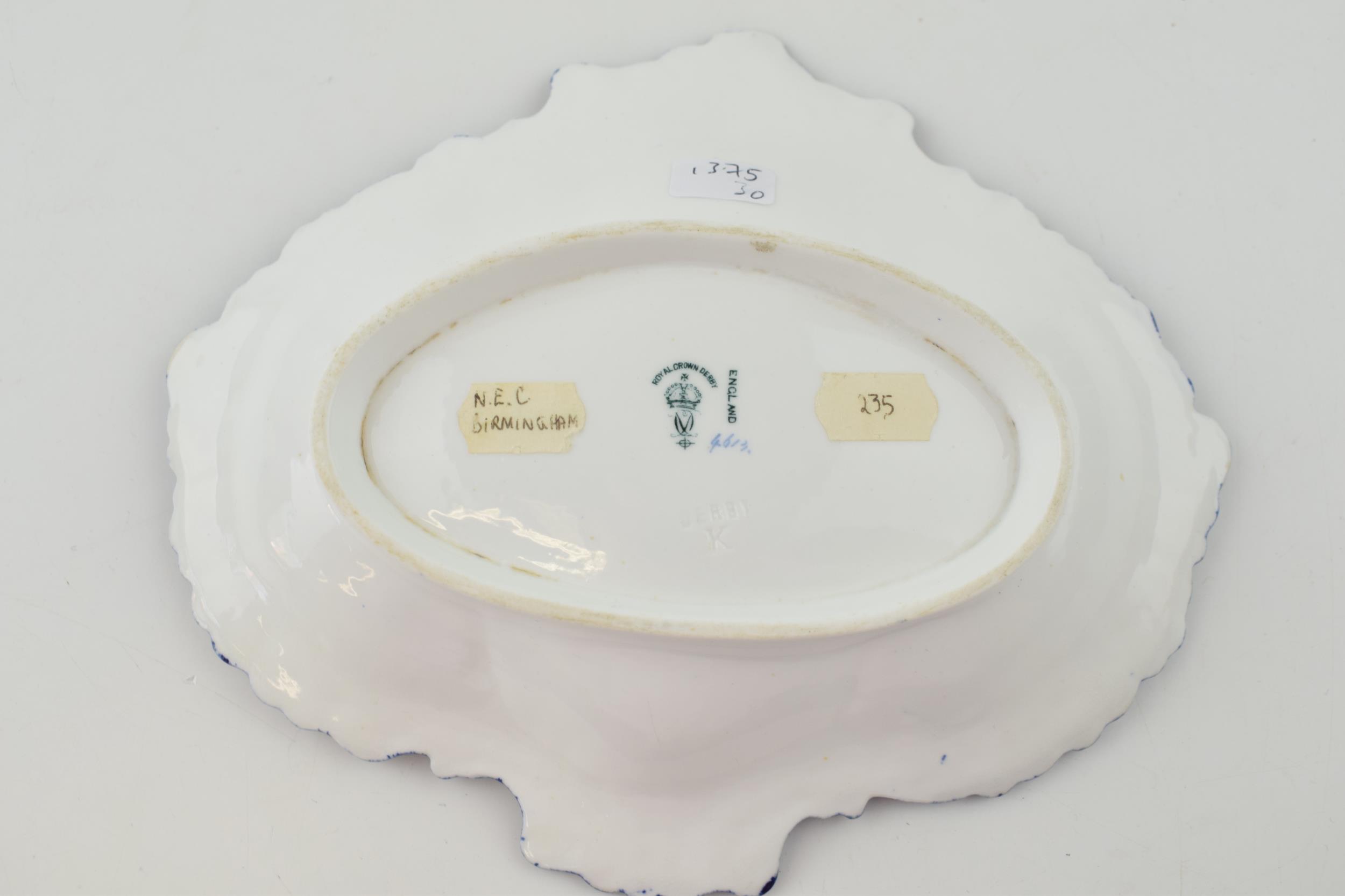 A Royal Crown Derby, hand-painted porcelain, moulded dessert dish, c. 1909. It is decoated with a - Image 2 of 3