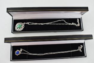 A pair of contemporary sterling silver necklaces with pendants (2).