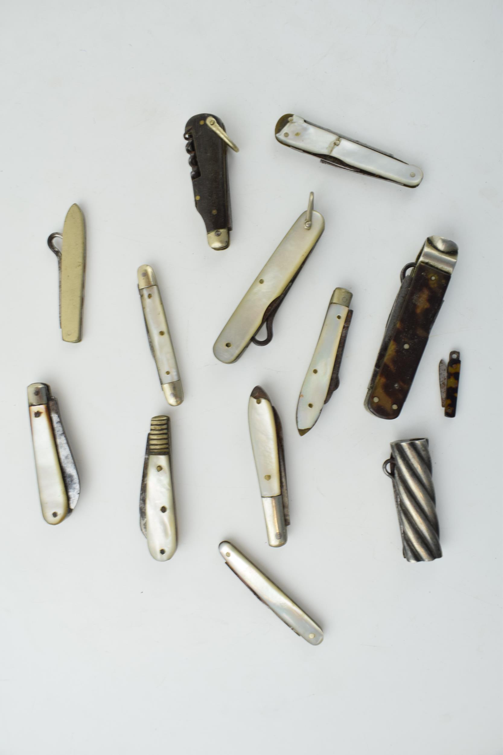 A collection of antique multifunction tool pocket knives to include mother pot pearl handled example - Image 5 of 9