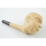 A clay pipe in the form of a man's head. Length 14cm. In good original condition. Free of damage