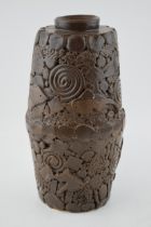 A large and heavy studio pottery vase, in brown colourway, decorated with fish and swirling