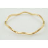 9ct gold shaped bangle, 4.1 grams, Clasp is a little dented around the ends.