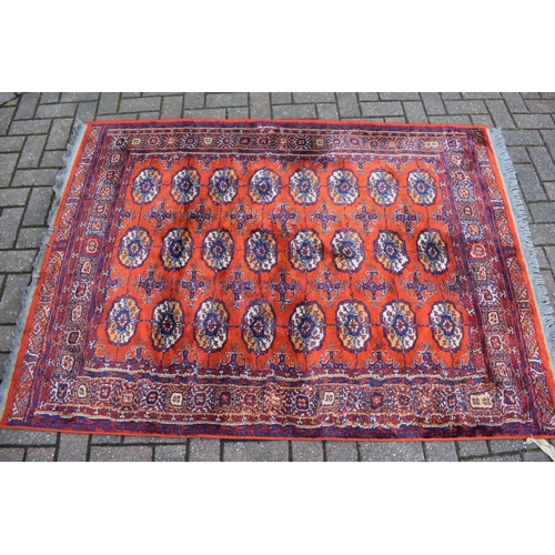 Bokhara carpet in cashmere and silk. Traditional elephants foot pattern with stylised floral