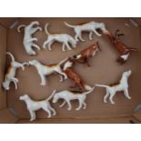 A collection of Beswick foxes and foxhounds (11). In good condition with no obvious damage or