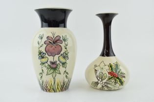 An early pair of Lorna Bailey tubelined vases, one in the Pansies pattern, and the other with
