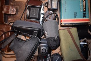 A collection of vintage cameras and accessories to include a Bell & Howell 28mm lense, a Nettar