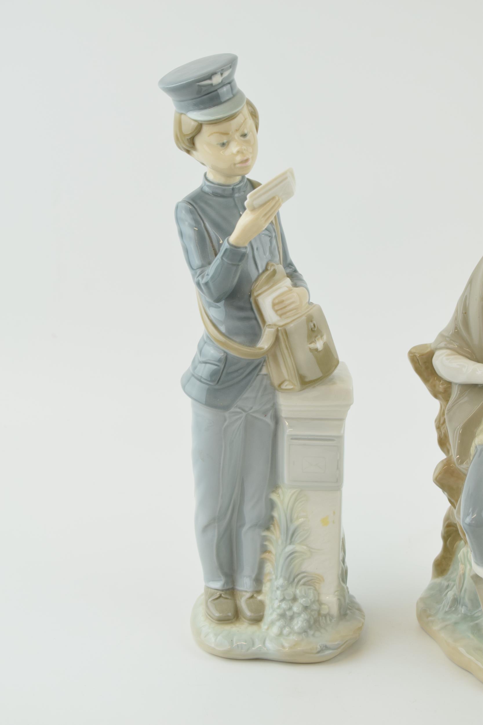 Lladro and Nao figures to include a postman and a hiker (2). In good condition with no obvious - Image 2 of 4