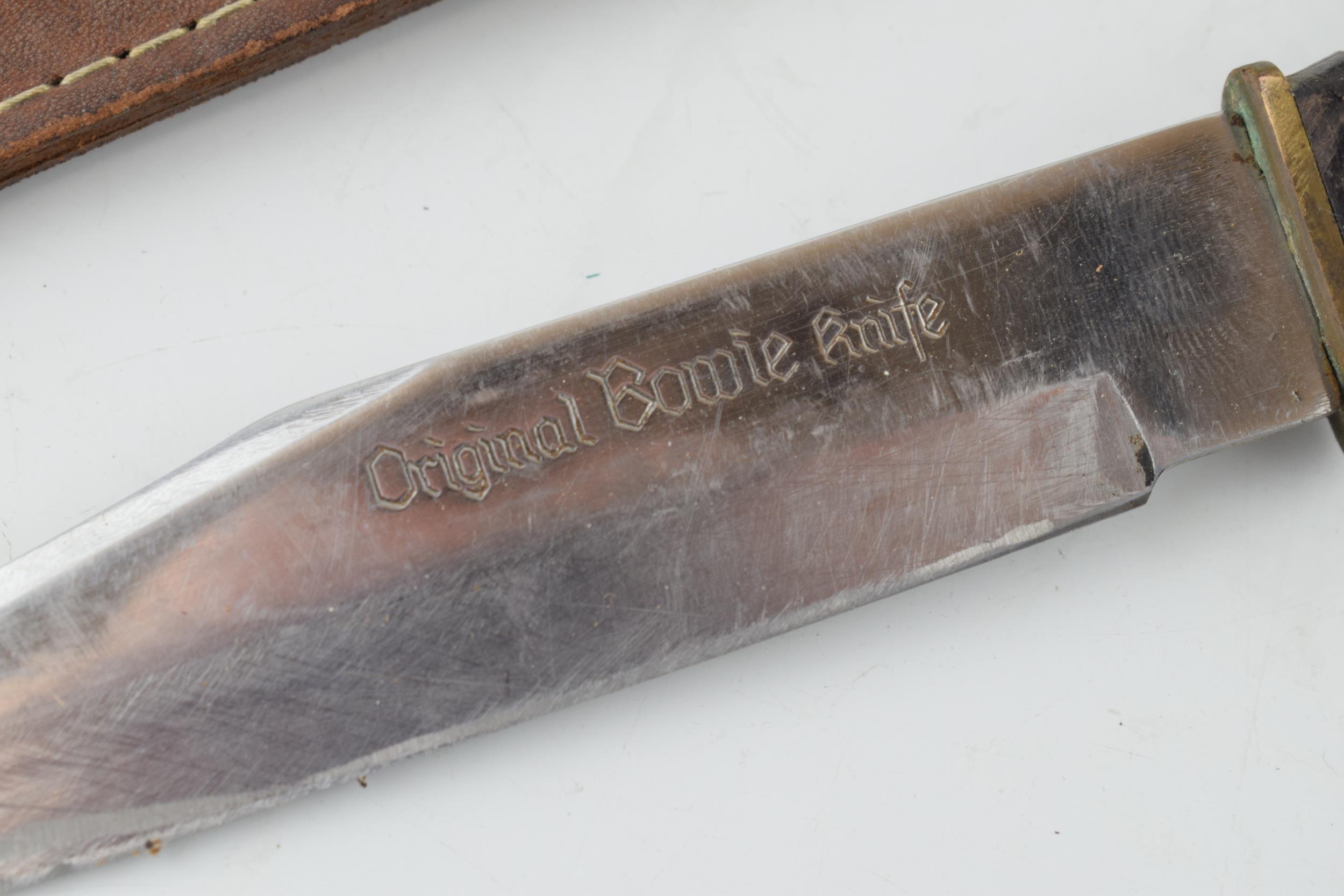 Bowie knife in leather sheath, 'Made in Japan'. Lather handle, 'Stainless Steel Blade', 'Original - Image 2 of 3