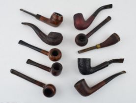 A collection of vintage tobacco smoking pipes to include briar examples by 'Parker', 'Carling', '