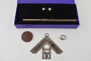 A silver Masonic regalia in the form of a set square together with a silver buckle ring, a bronze