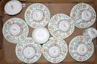 A collection of Minton Haddon Hall tea ware to include 7 trios, a spare cup, a sugar bowl and milk