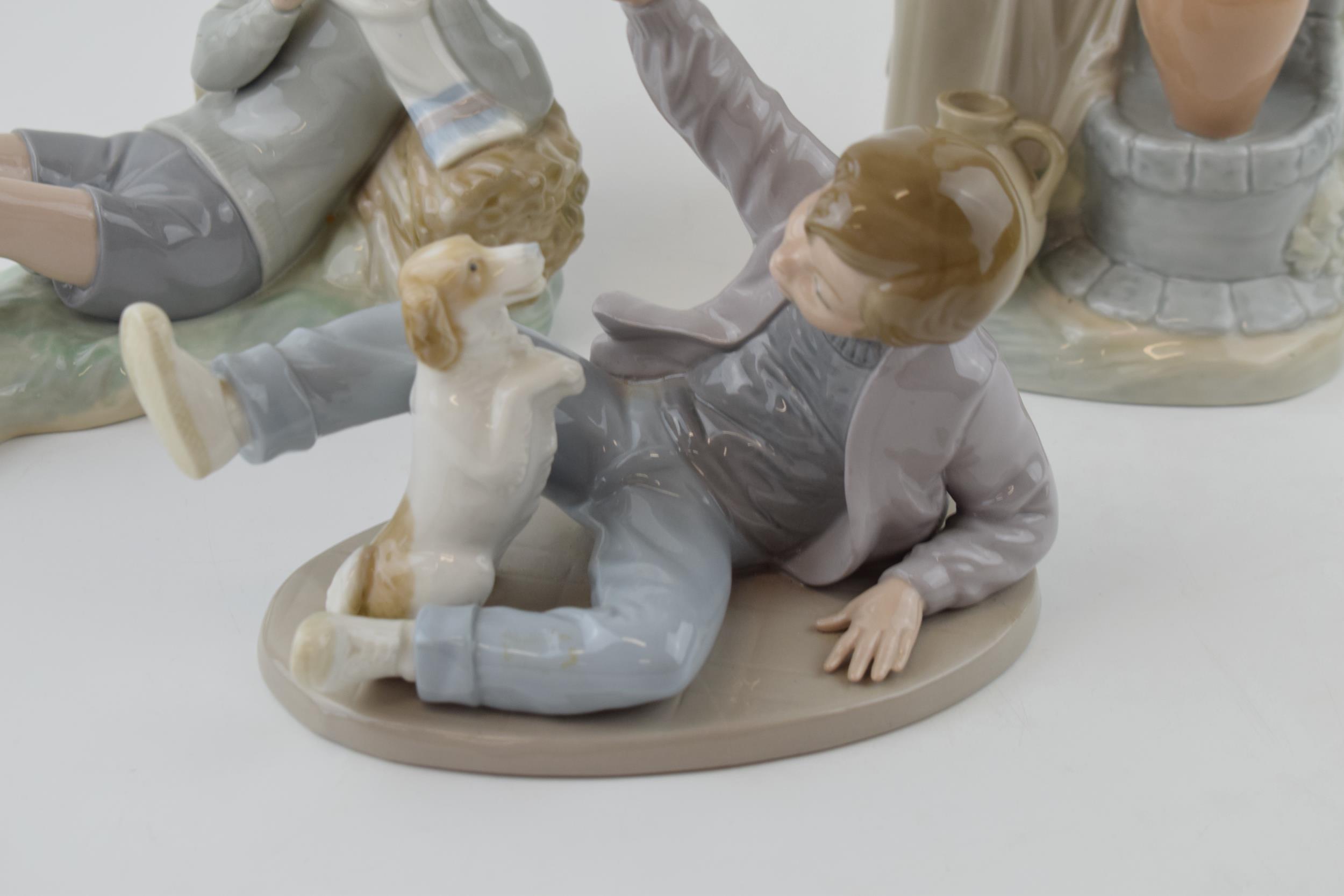 A trio of figures to include a Lladro boy with a bird on his foot (bird glued back), with a pair - Image 2 of 4