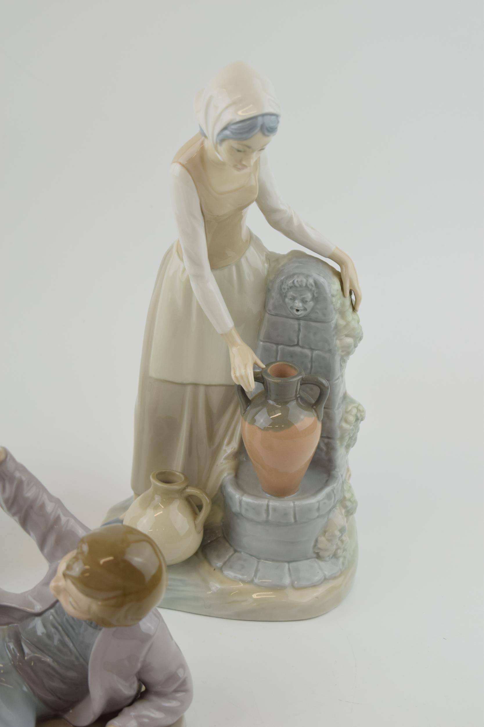 A trio of figures to include a Lladro boy with a bird on his foot (bird glued back), with a pair - Image 4 of 4