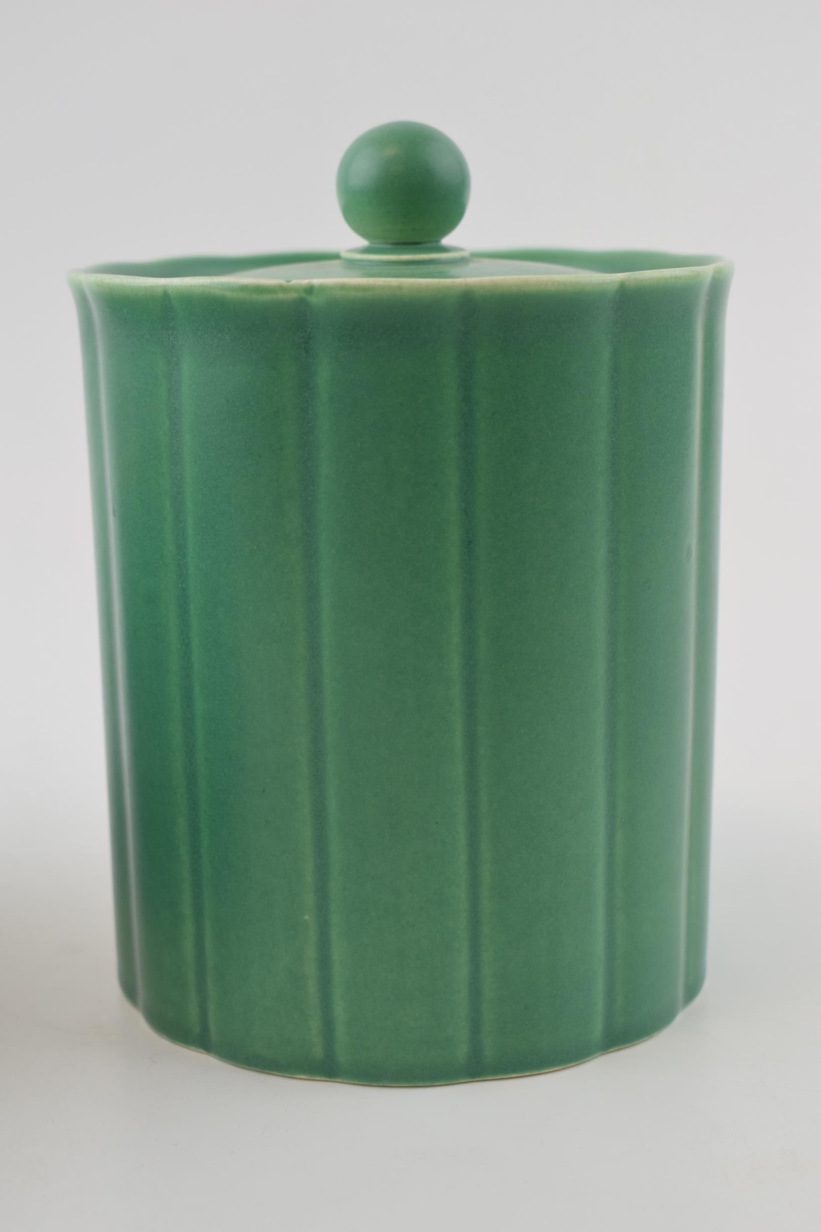 Wedgwood Keith Murray biscuit barrel / lidded jar in green. Height 15cm. In good condition with no