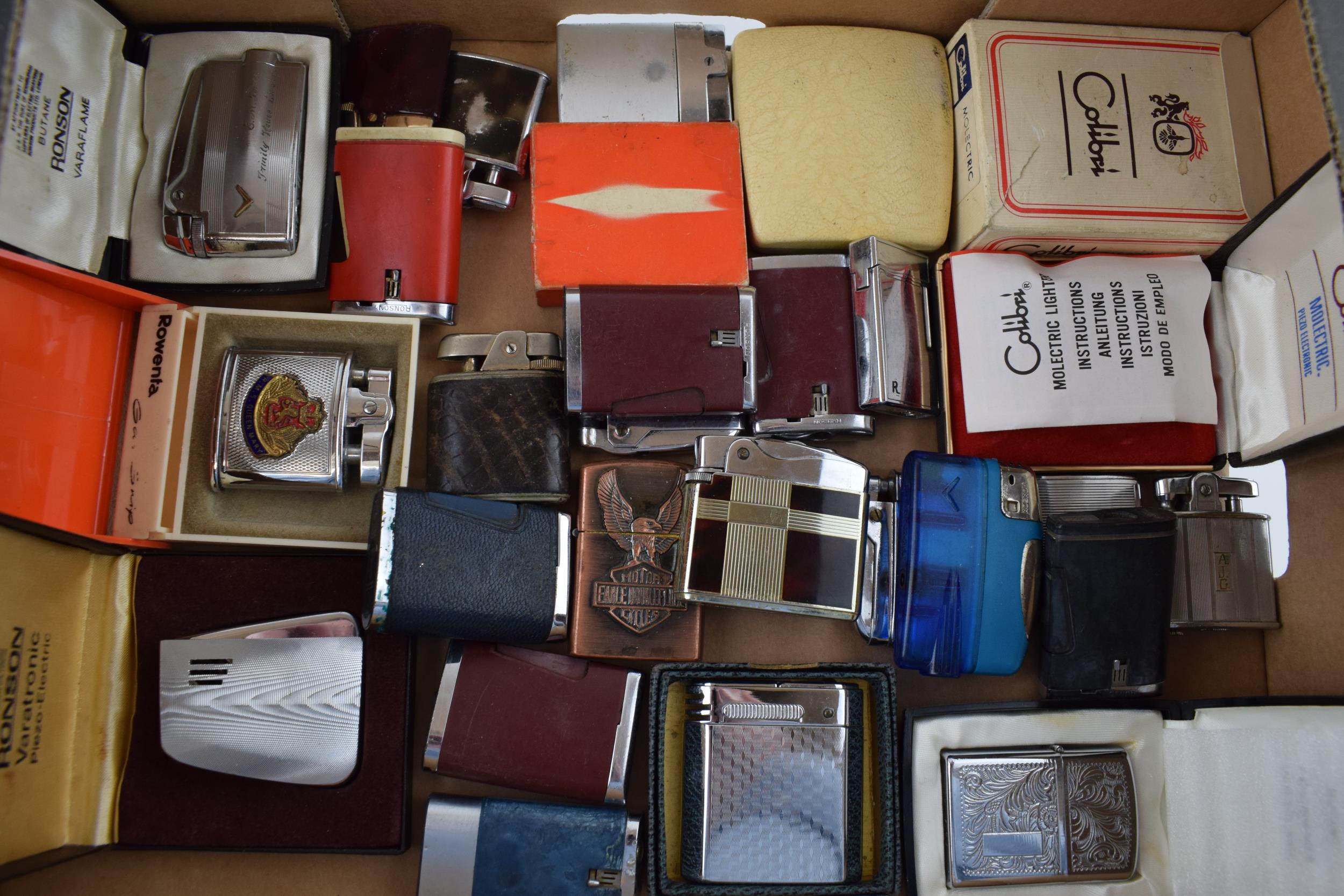 A mixed collection of vintage cigarette lighters to include boxed examples by manufacturers Calibre,