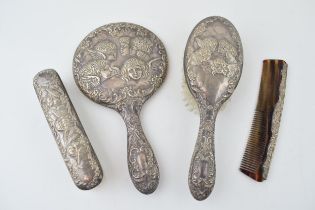 Hallmarked silver dressing table set in the Reynolds Angels design to include a mirror, a comb and