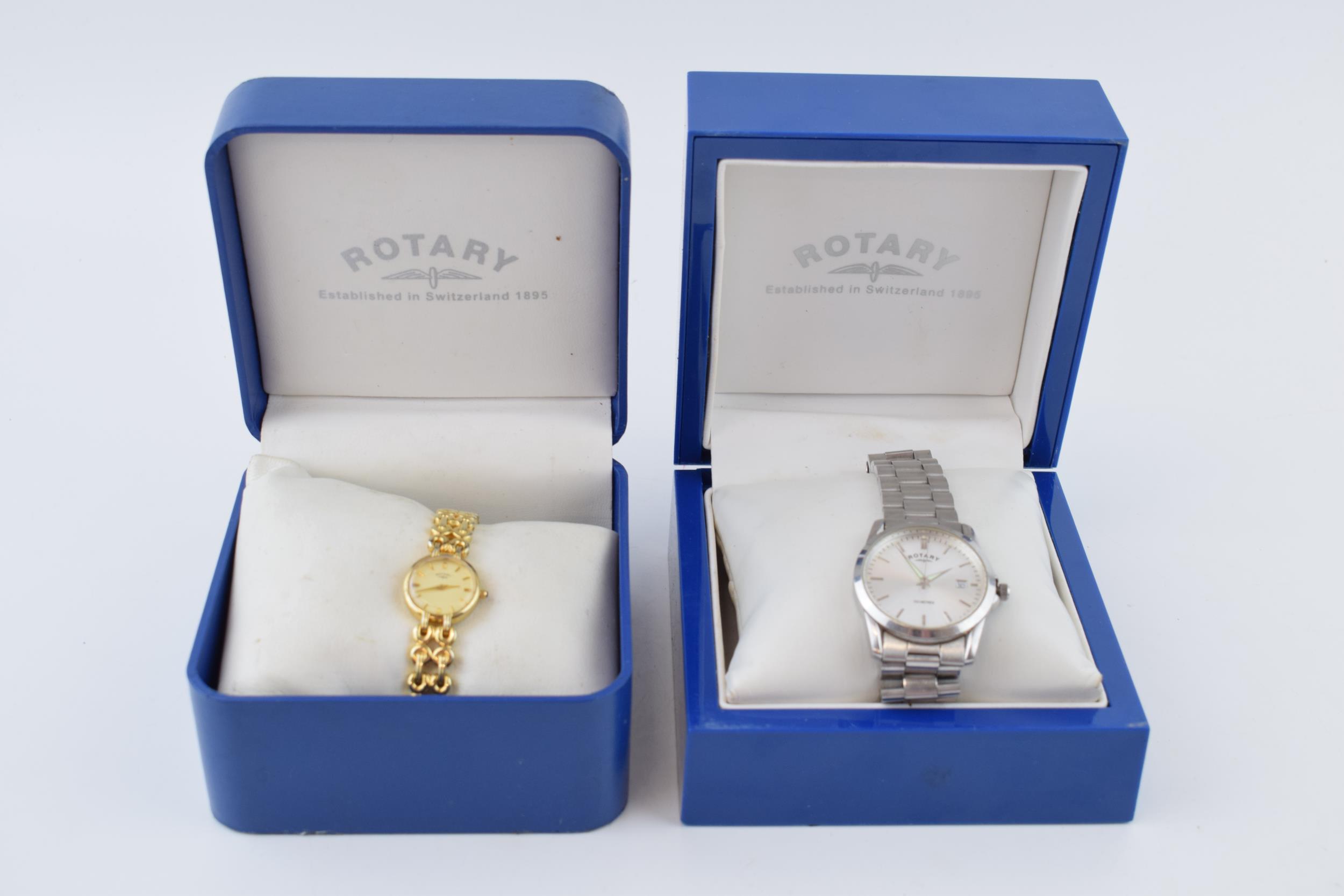 A pair of boxed Rotary wristwatches to include a ladies gilt watch and a gents steel watch, 34mm (