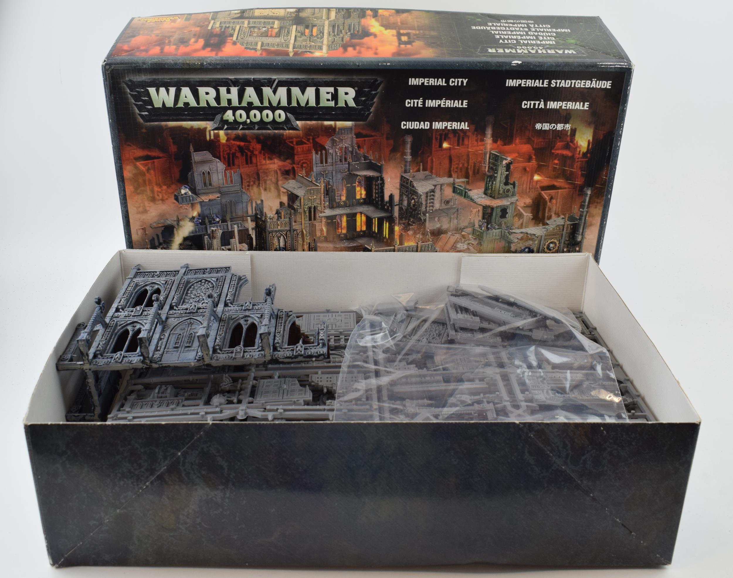 Boxed Warhammer 40,000 Imperial City. Mostly unbuilt with part that is built proffesionally