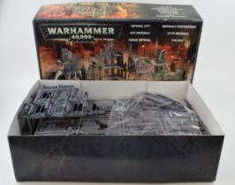 Boxed Warhammer 40,000 Imperial City. Mostly unbuilt with part that is built proffesionally