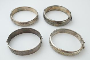 A collection of 4 silver bangles / bracelets, with working clasps, 123.6 grams (4).