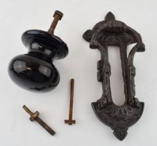 A Kenrick and Sons or similar door knocker together with a ceramic Victorian door knob. (2) 23cm.