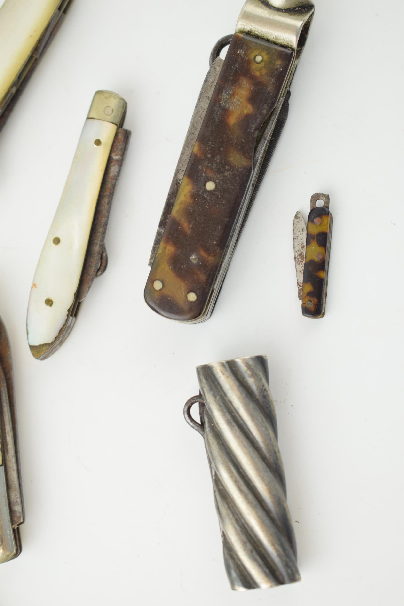 A collection of antique multifunction tool pocket knives to include mother pot pearl handled example - Image 9 of 9
