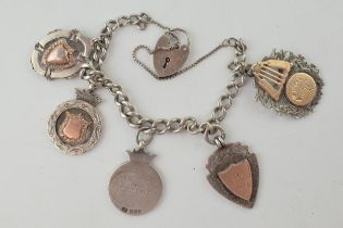 A graduated silver Albert chain converted to a bracelet, hallmarks to every link with five Edwardian