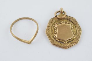 A 9ct yellow gold fob together with a 9ct yellow ladies ring. 6.4 grams. In good usable condition.