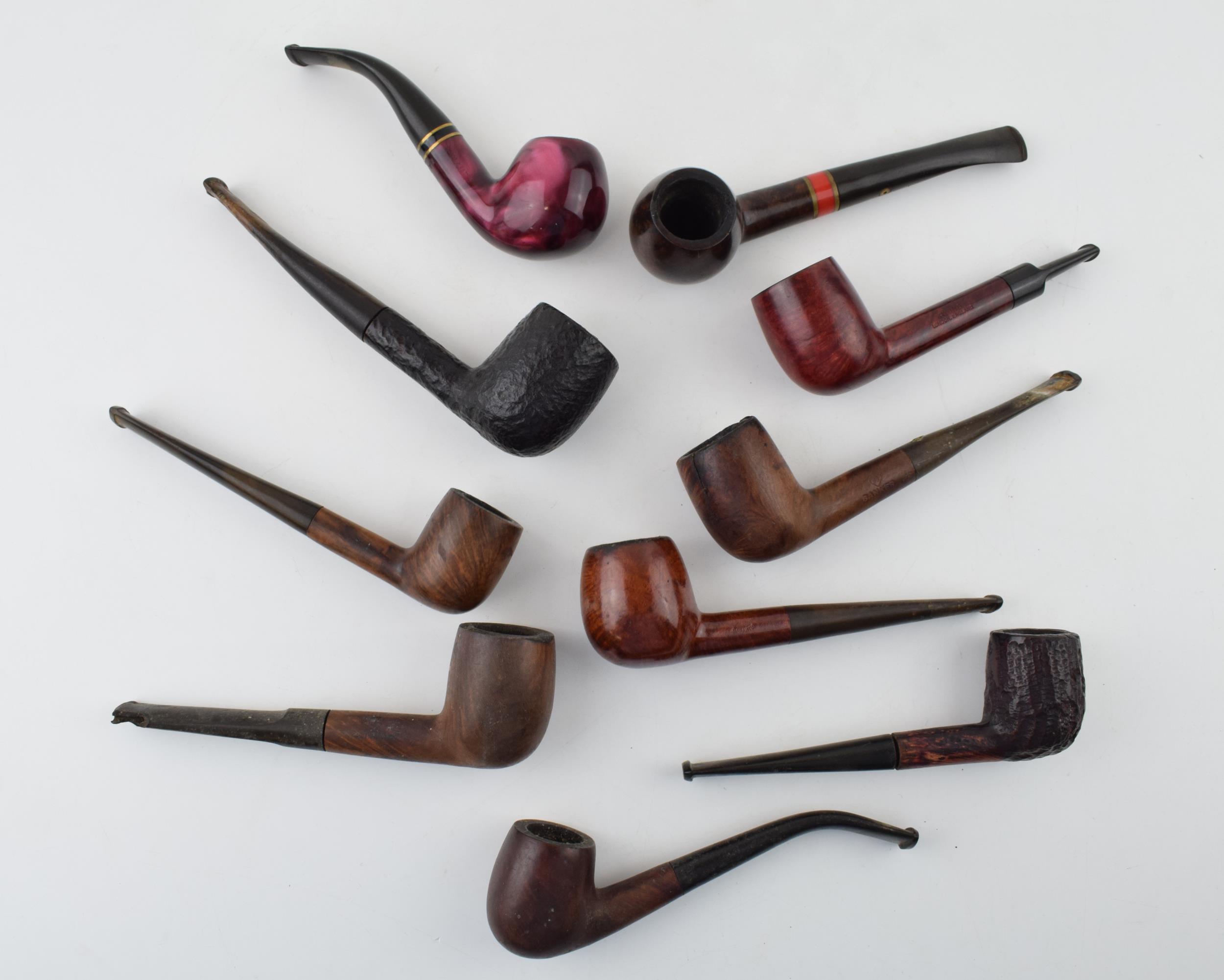 A collection of vintage tobacco smoking pipes to include briar and similar examples by 'St
