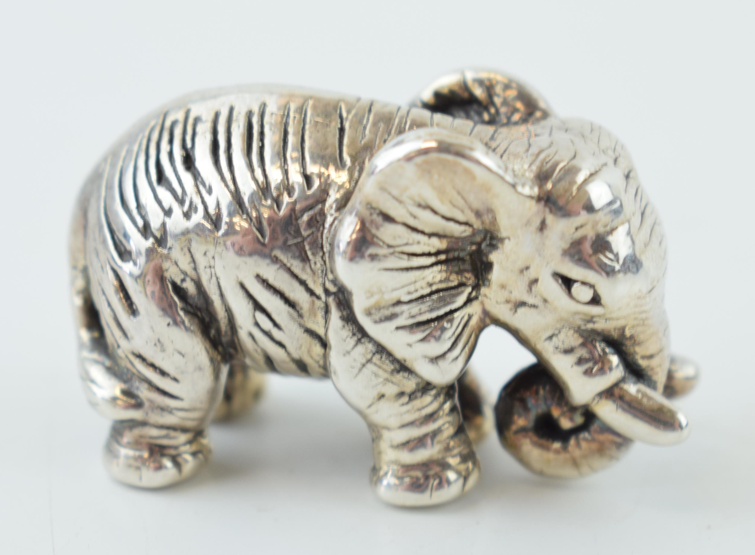 Silver figure of an elephant, 4cm long, 13.8 grams, stamped sterling.