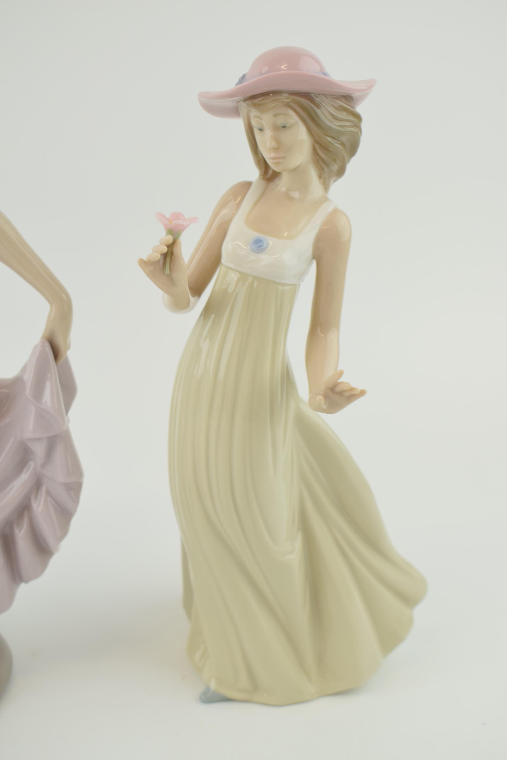 Nao figures to include a girl in a purple dress a girl with a basket of flowers and a girl holding a - Image 2 of 4