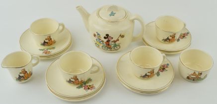 Beswick Disneyland childs teaset to include a teapot, 4 trios, a milk jug and a sugar bowl (Qty). In