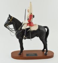 Beswick Life Guard, a Connoisseur model on a wooden base. In good condition with no obvious damage