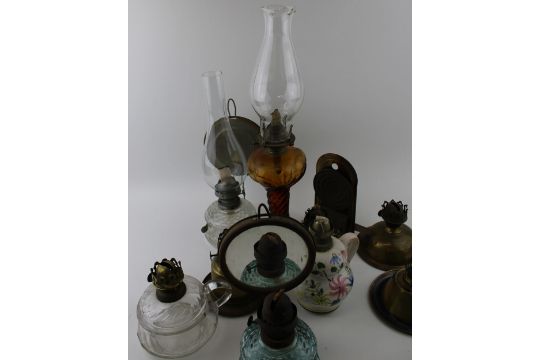 A mixed collection of vintage and antique tin, pottery and brass oil lamps with glass chimneys and - Image 3 of 6