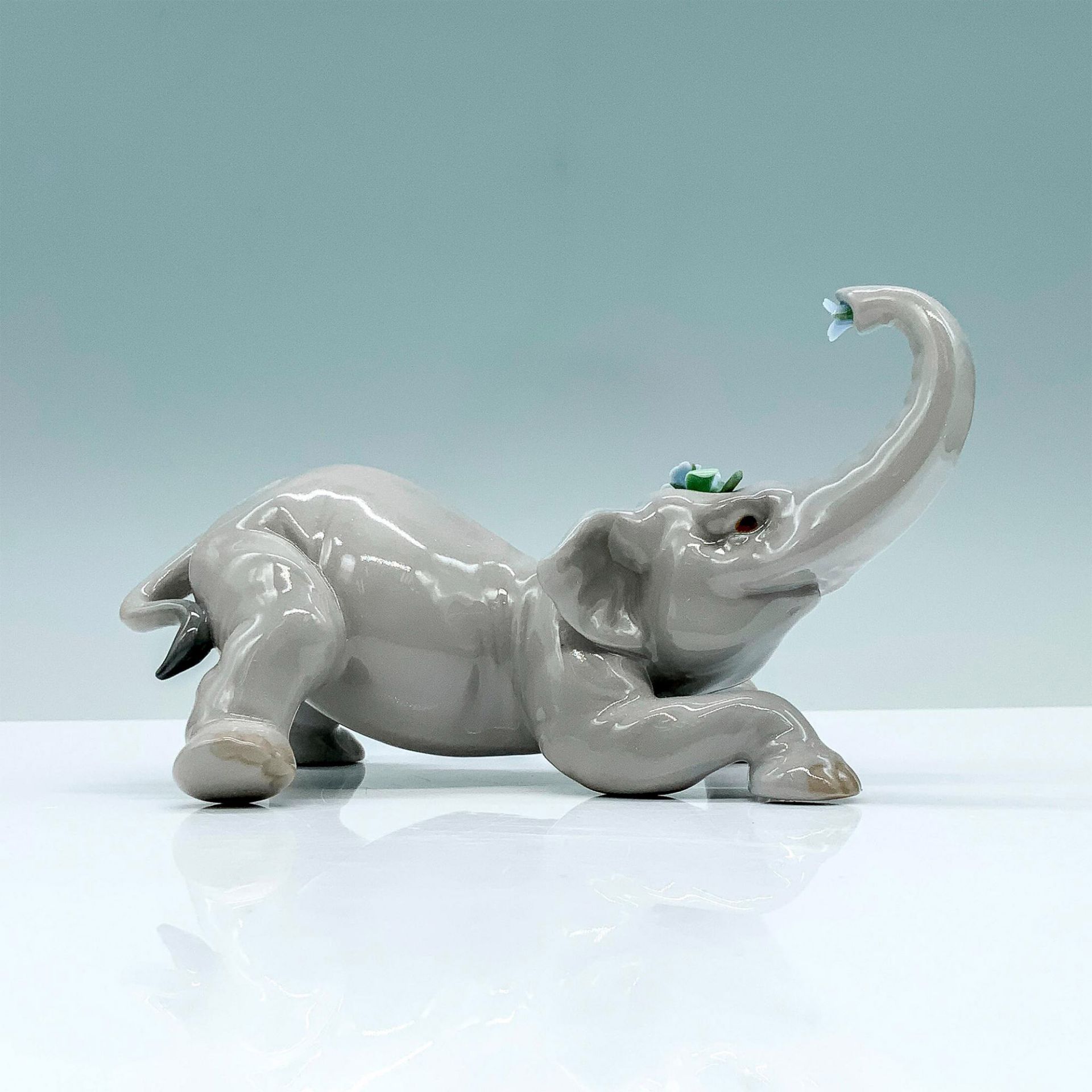 Baby Elephant With Blue Flower 1008490 - Lladro Porcelain Figurine