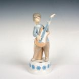 Lladro Porcelain Musical Figurine, Boy w/ Guitar 1004614