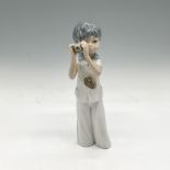 Casades Porcelain Figurine, Boy with a Camera