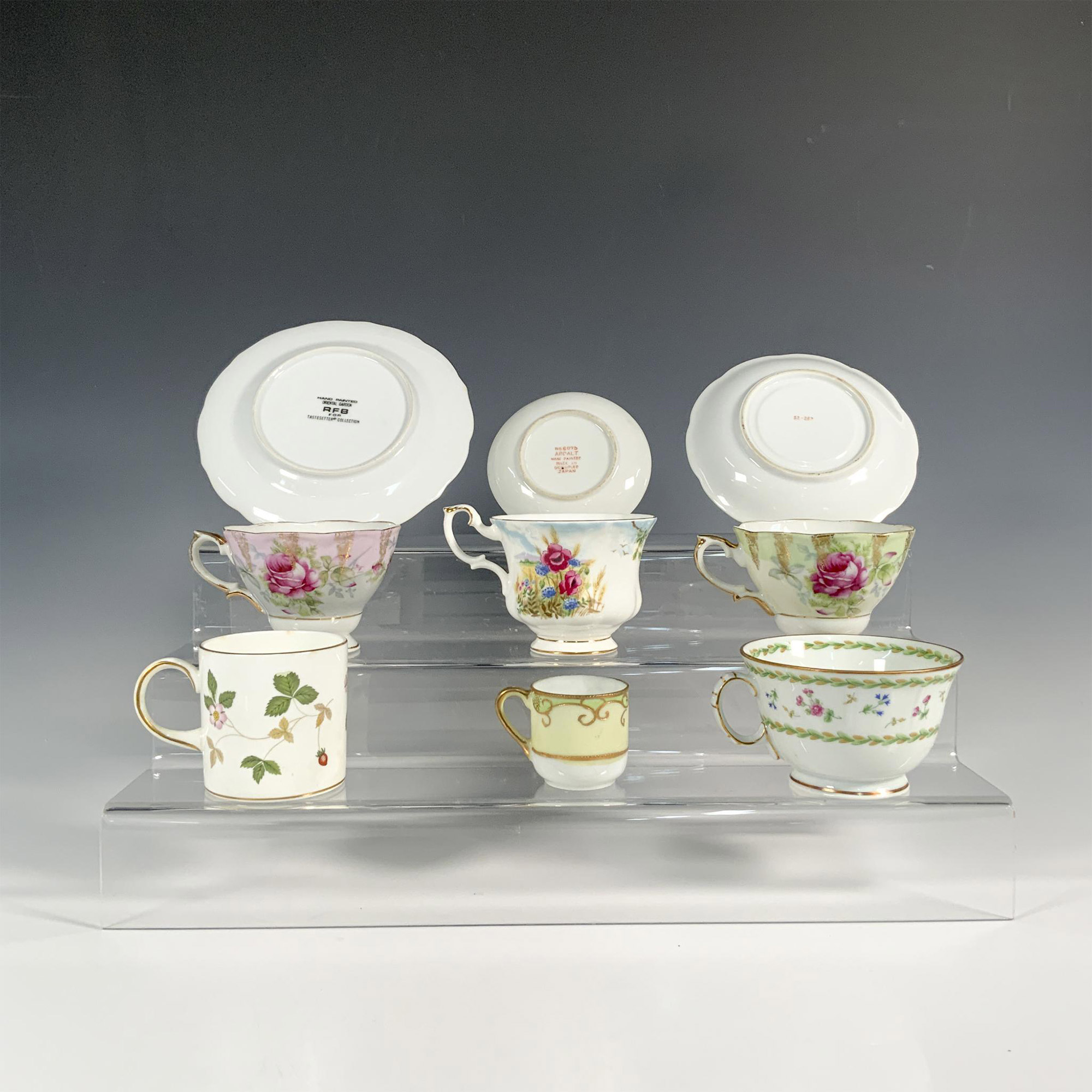 9pc Porcelain Floral Motif Teacups, Saucers, and Demitasse - Image 2 of 3