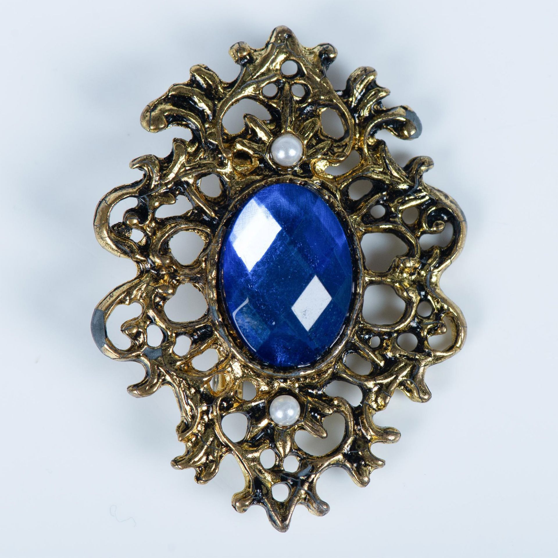 Ornate Gold Metal, Faux Pearl and Blue Rhinestone Brooch