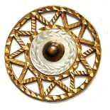 A division one pierced brass colored copper button