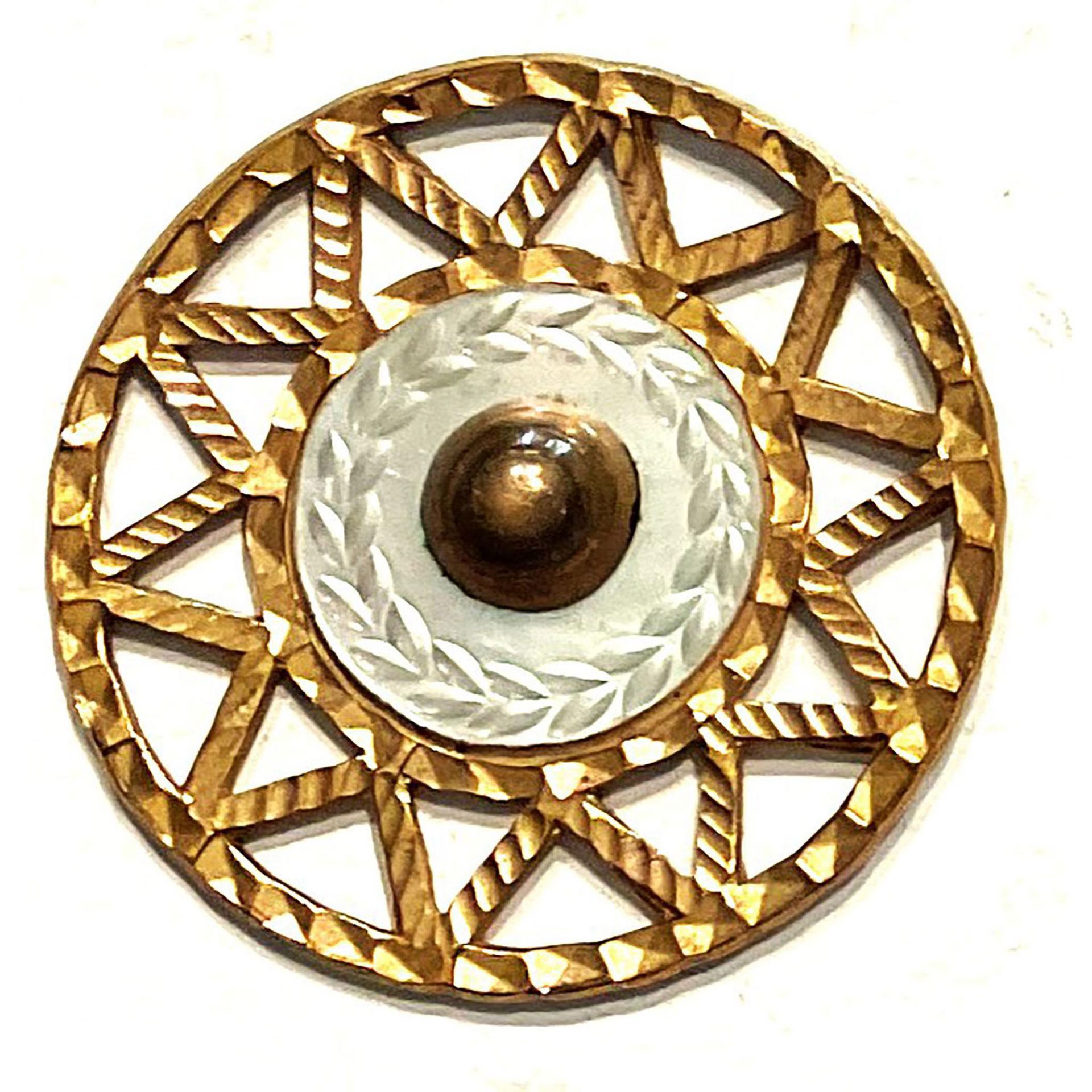 A division one pierced brass colored copper button