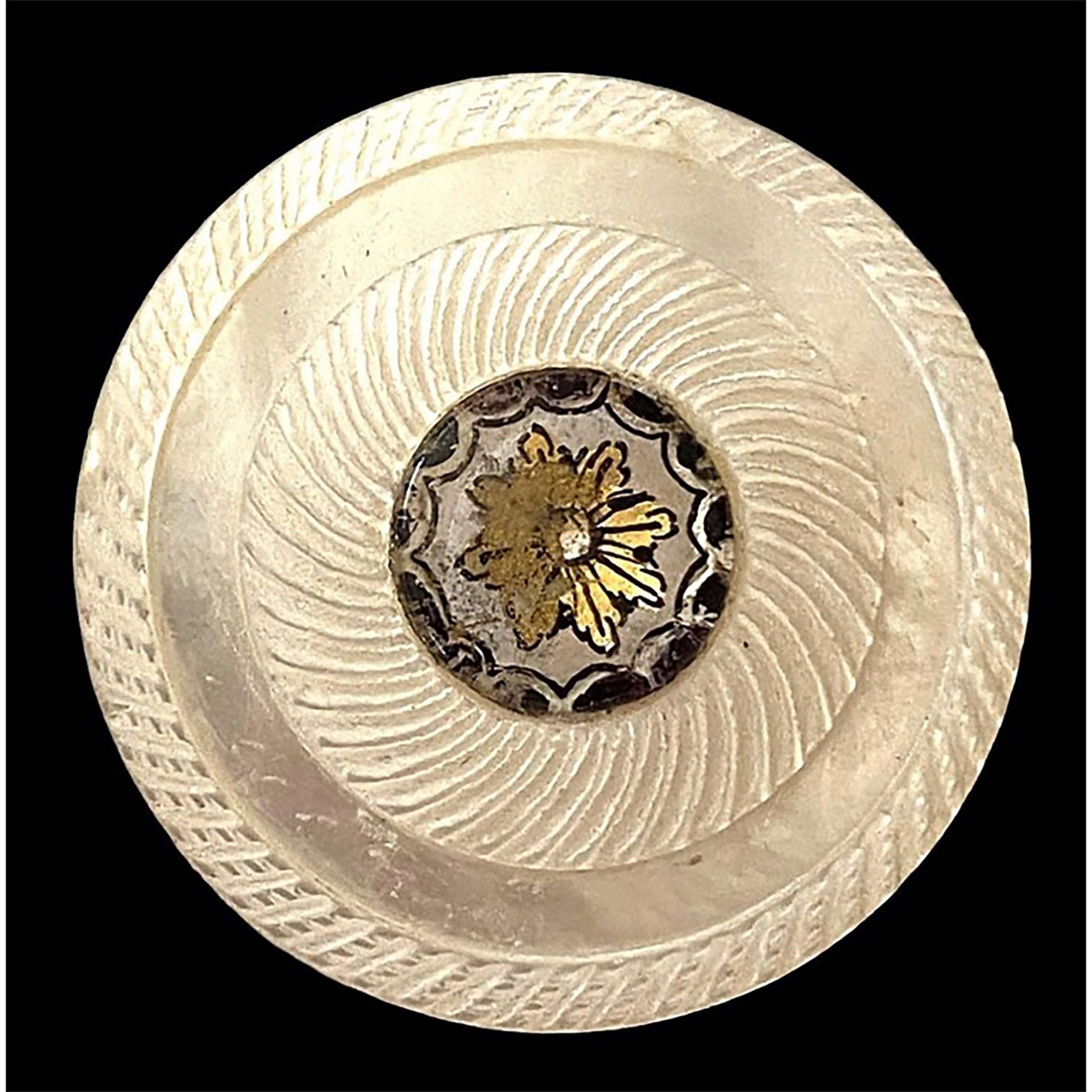 A division one pearl with glass center button