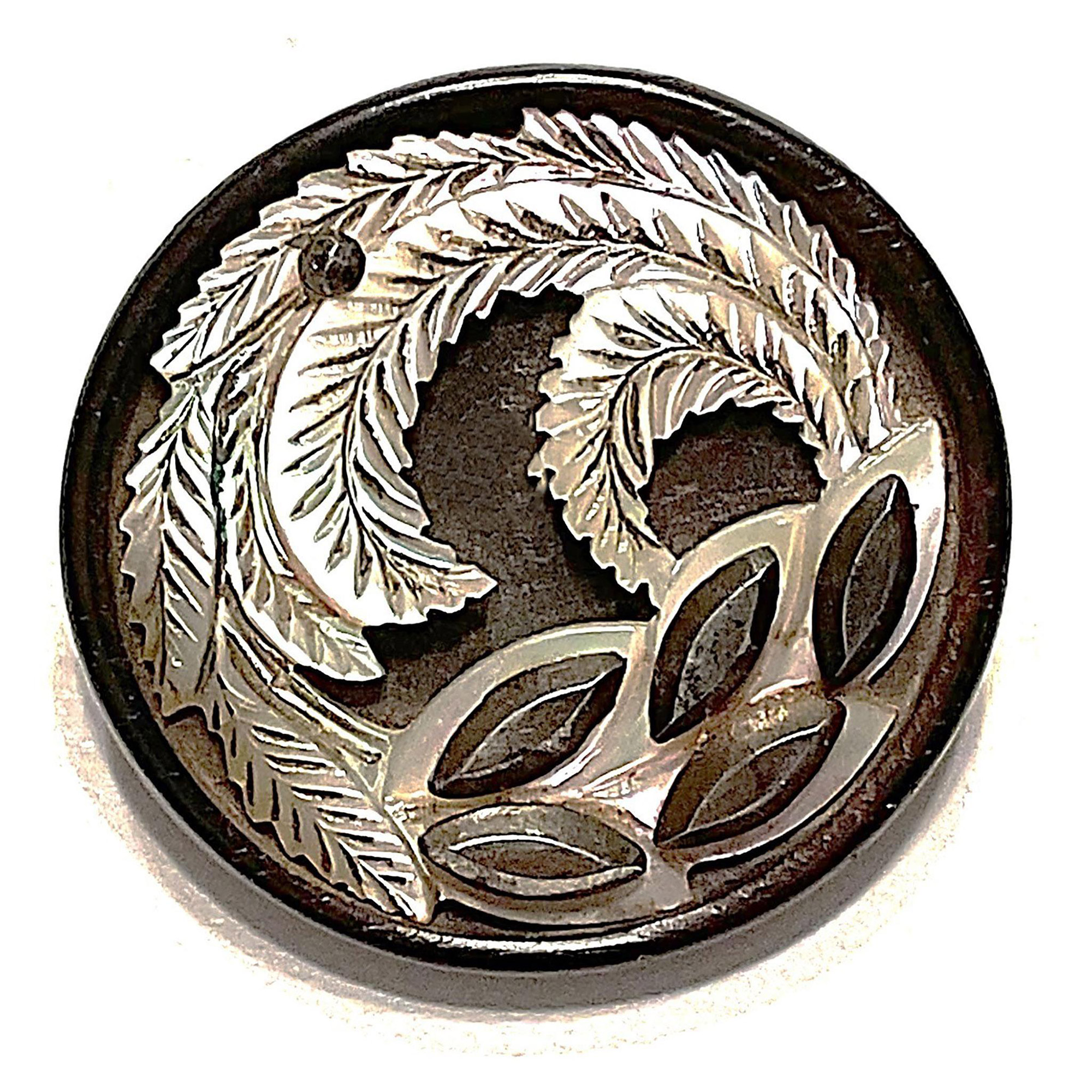 A division one carved pearl in wood button