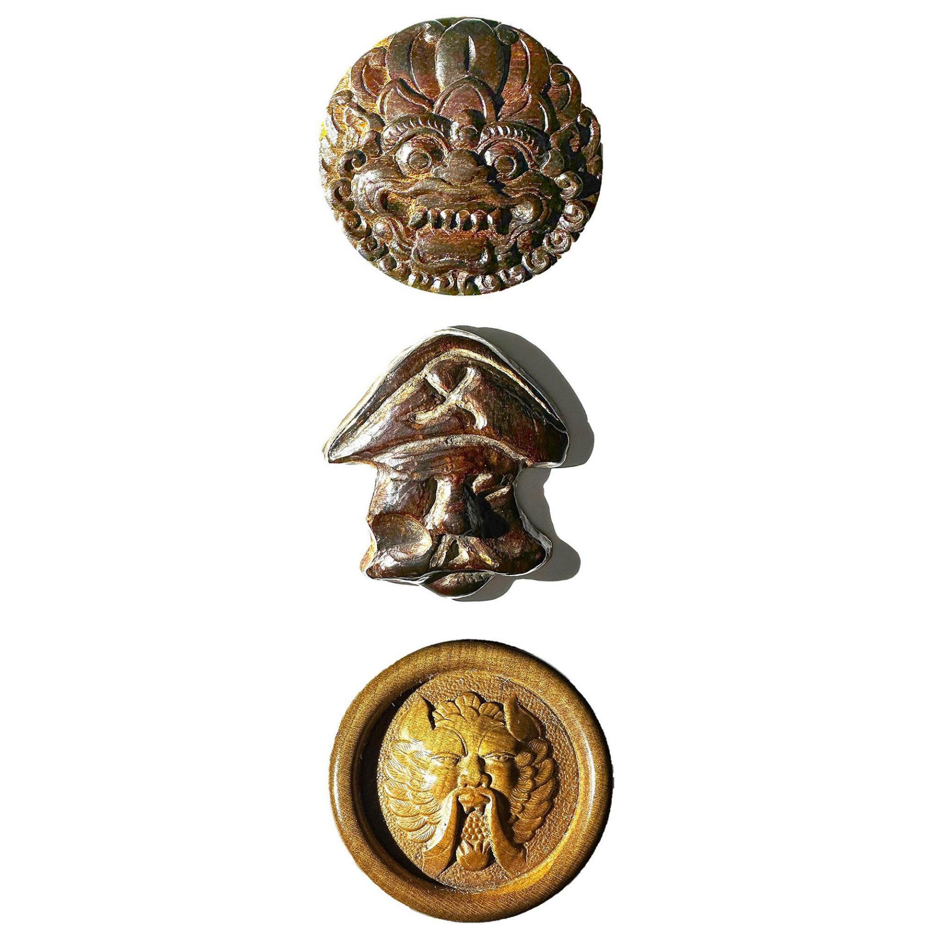 A small card of assorted carved wood buttons