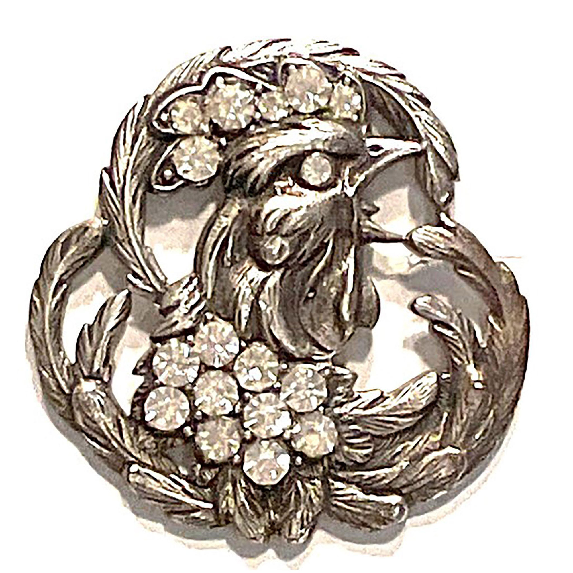 A division one pierced metal and paste rooster button